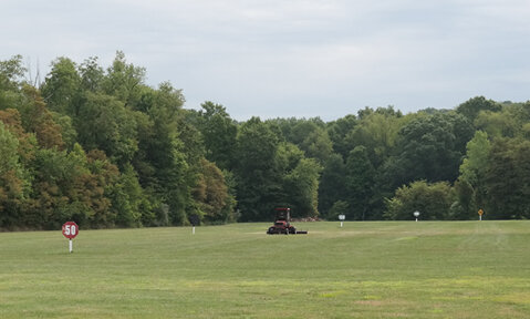 Golf Ball Picker Sweeping the Range