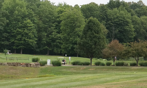 Golfers finishing their round on Hole 7