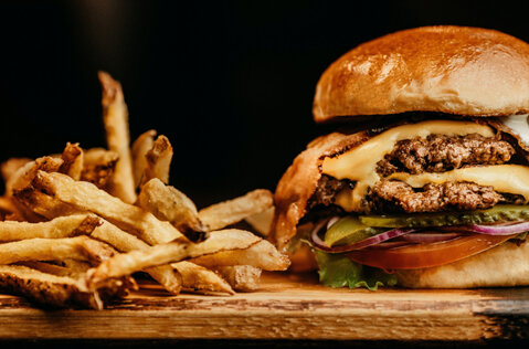 A juicy and delicious cheeseburger and french fries